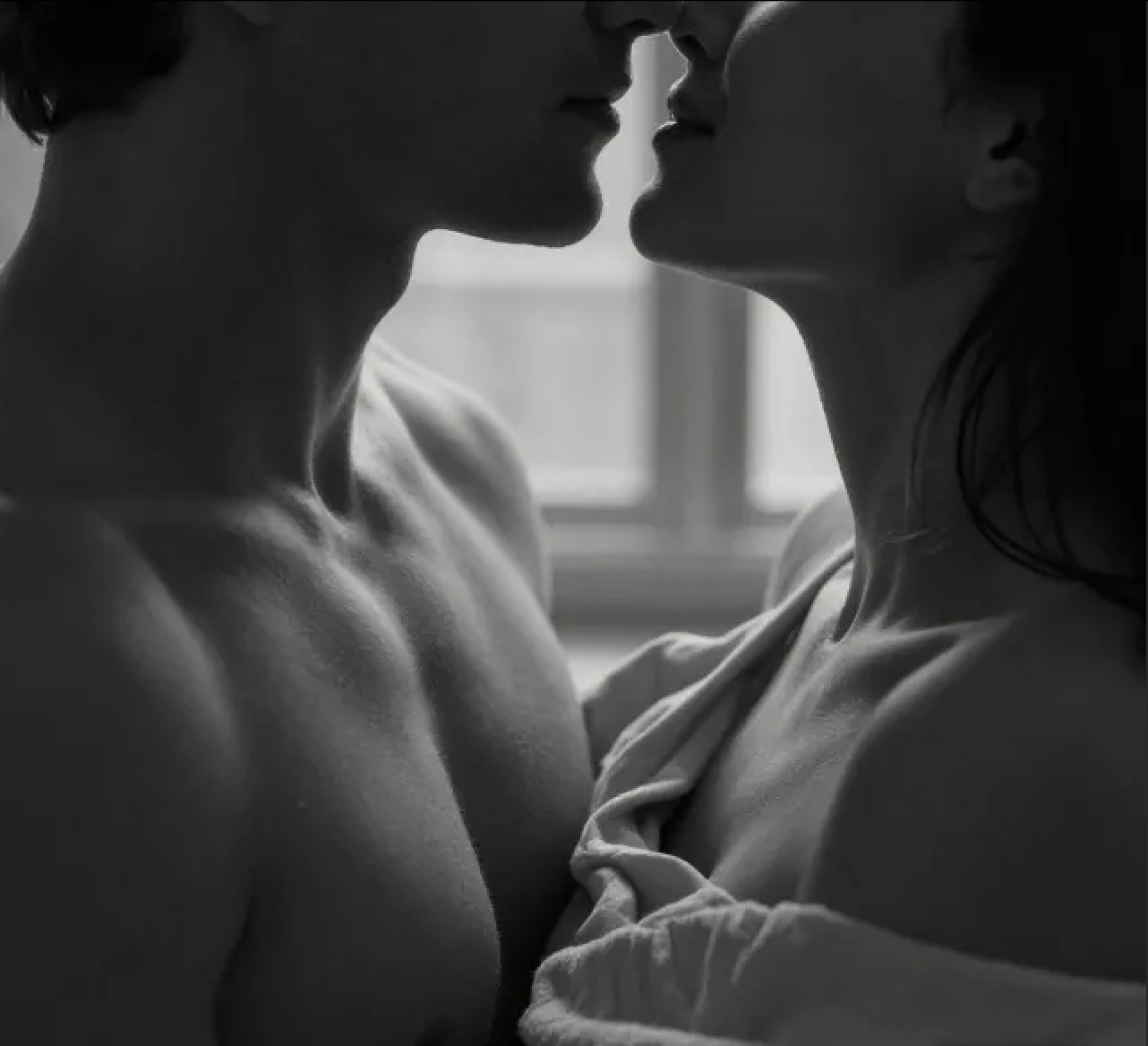 couple in close connection hug black and white