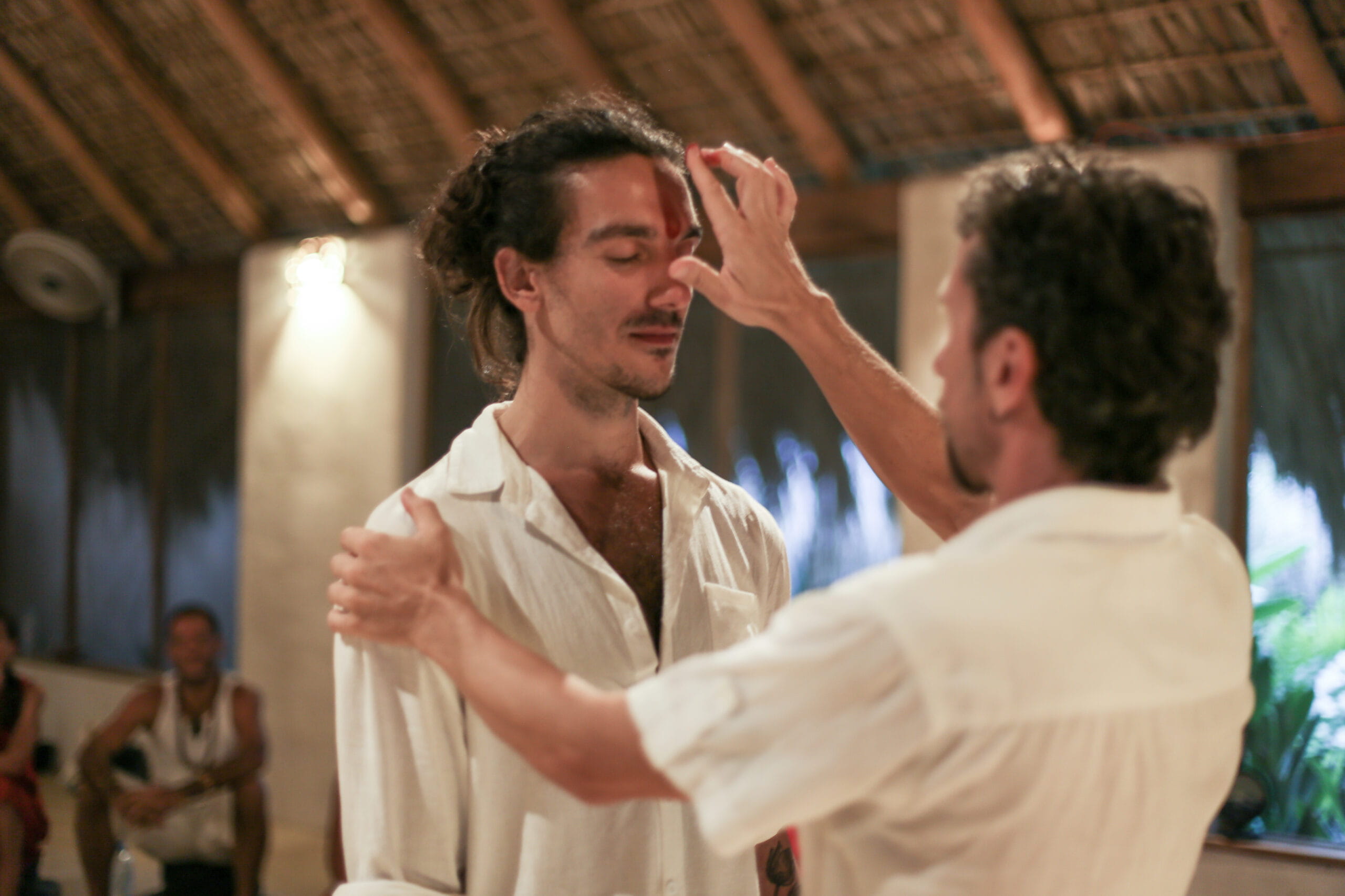 A man recieves the talik as part of a ceremony