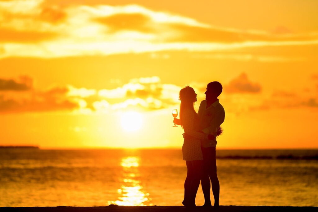 Couple in close connection hugging at sunset
