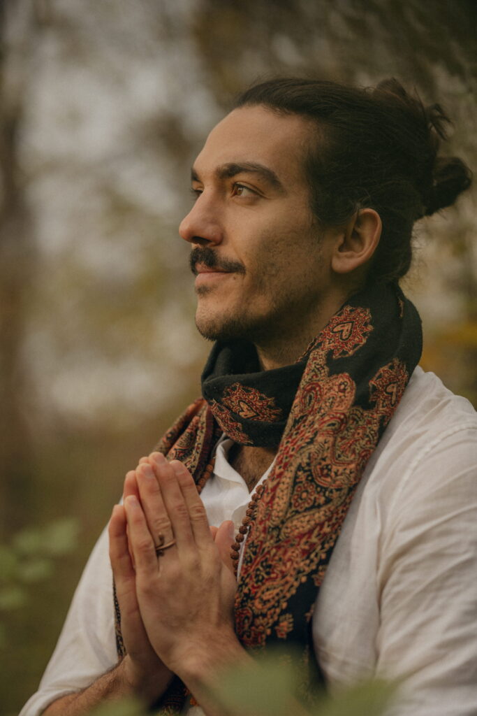 Nicolas Loewer looking past the camera with a calm, confident expression—symbolizing clarity, trust, and inner alignment