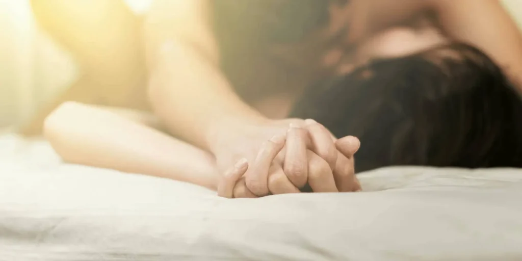 Sensual hands of a couple in close connection