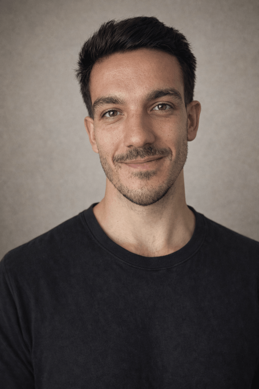 a portrait of nicolas loewer smiling into the camera