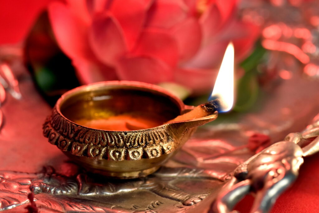 Tantric oil lamp as a ritual element in a workshop, symbolizing presence, mindfulness, and inner light