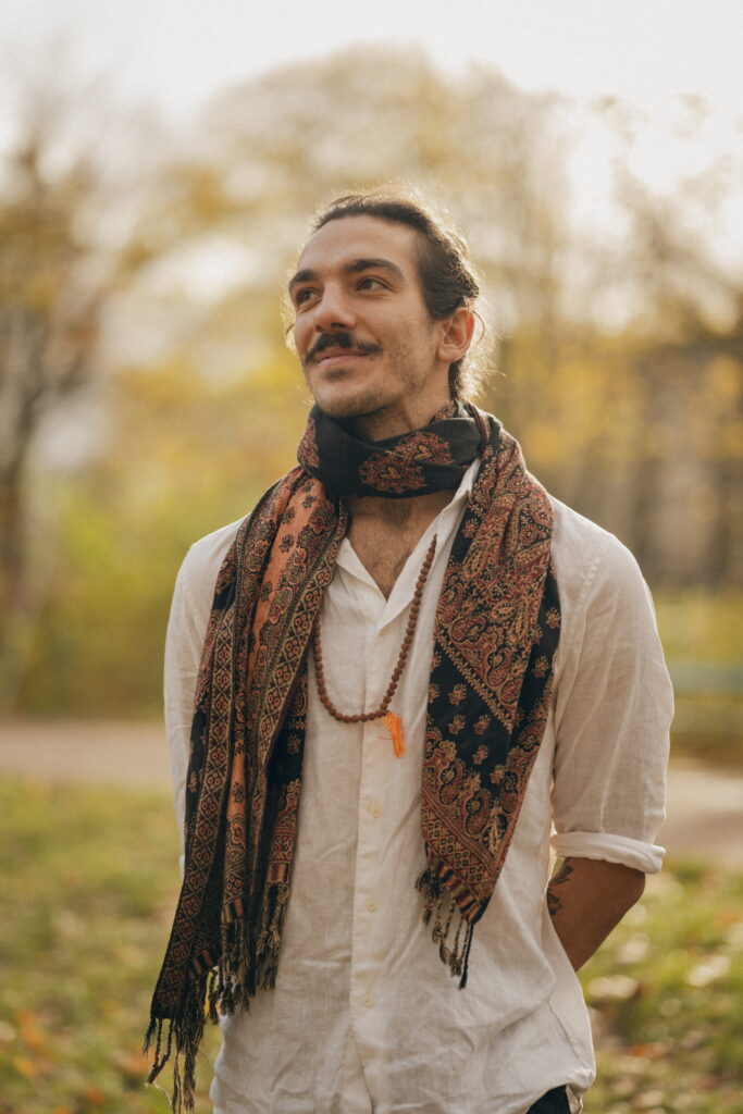 Nico Loewer smiling softly while looking into the distance—an expression of confidence and clarity